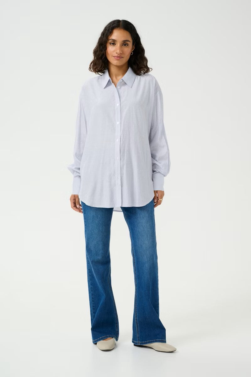 A simple yet striking striped shirt from KAFFE clothing. This great light weight shirt is adorned with tiny sparkles. There is a standard shirt collar and cuffs with two buttons to fasten. The fit is true to size.