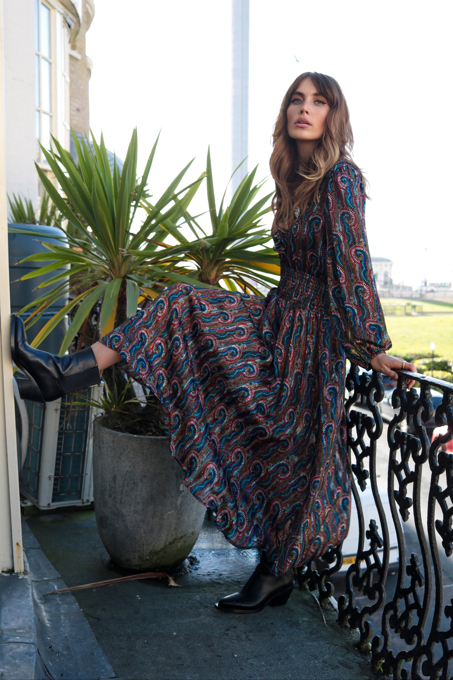 The Ballad dress from British brand Traffic People is a beautiful occasion piece. This stunning dress has a V neck with frill detail and buttons to fasten. The waist is elasticated for a flattering shape. The skirt is full and colourful. The full sleeves have an elasticated cuff. The fit is very neat. The fabric is quite sheer and would need a slip.