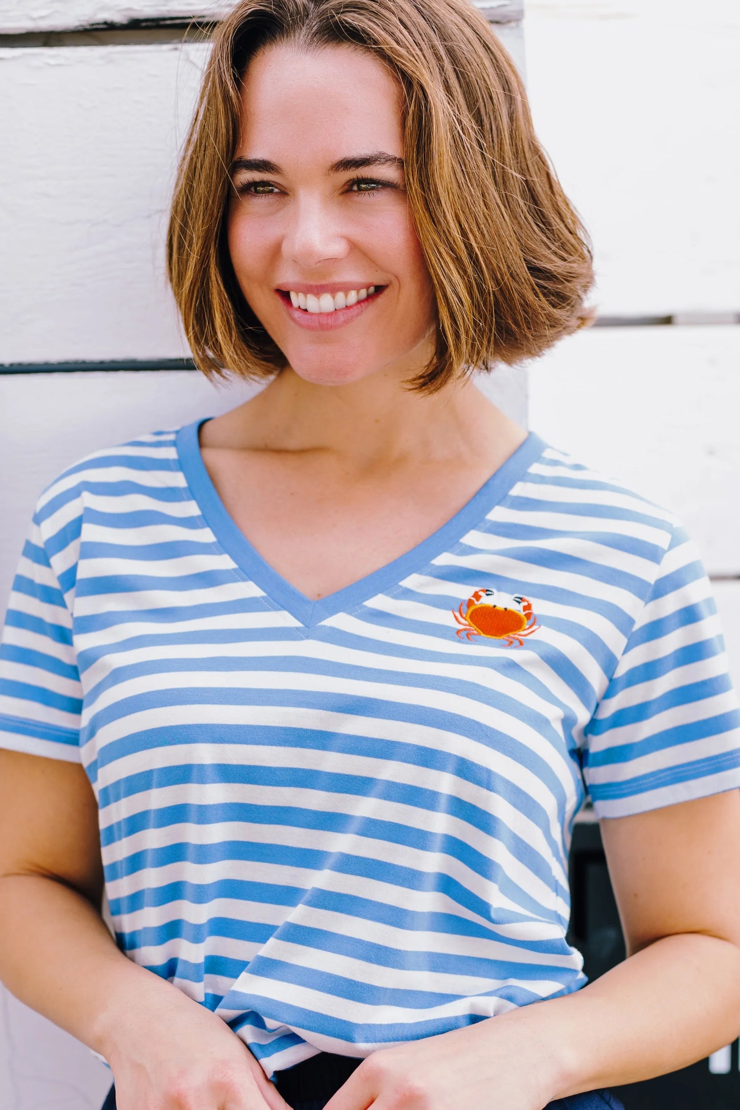 We've updated our signature t-shirt shape! The NEW Khloe from SUGARHILL has straight side seams and a straight back, plus we've added a much-requested deep v-neckline. We love the soft pastel blue and white stripe print, but it's the soft 100% Organic Cotton base that makes this tee extra special.