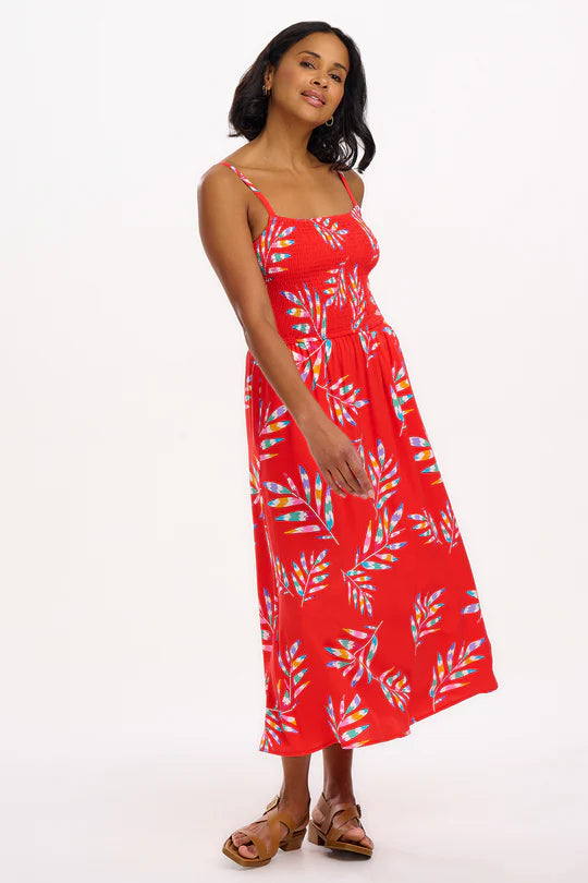 We're completely smitten with this extra-special dress from SUGARHILL, featuring our new Rainbow Fronds print of colourful tropical leaves with a vibrant red base. on a feminine shirred bust sundress. The Christabel Sundress falls at a midi length with a full skirt and pockets.