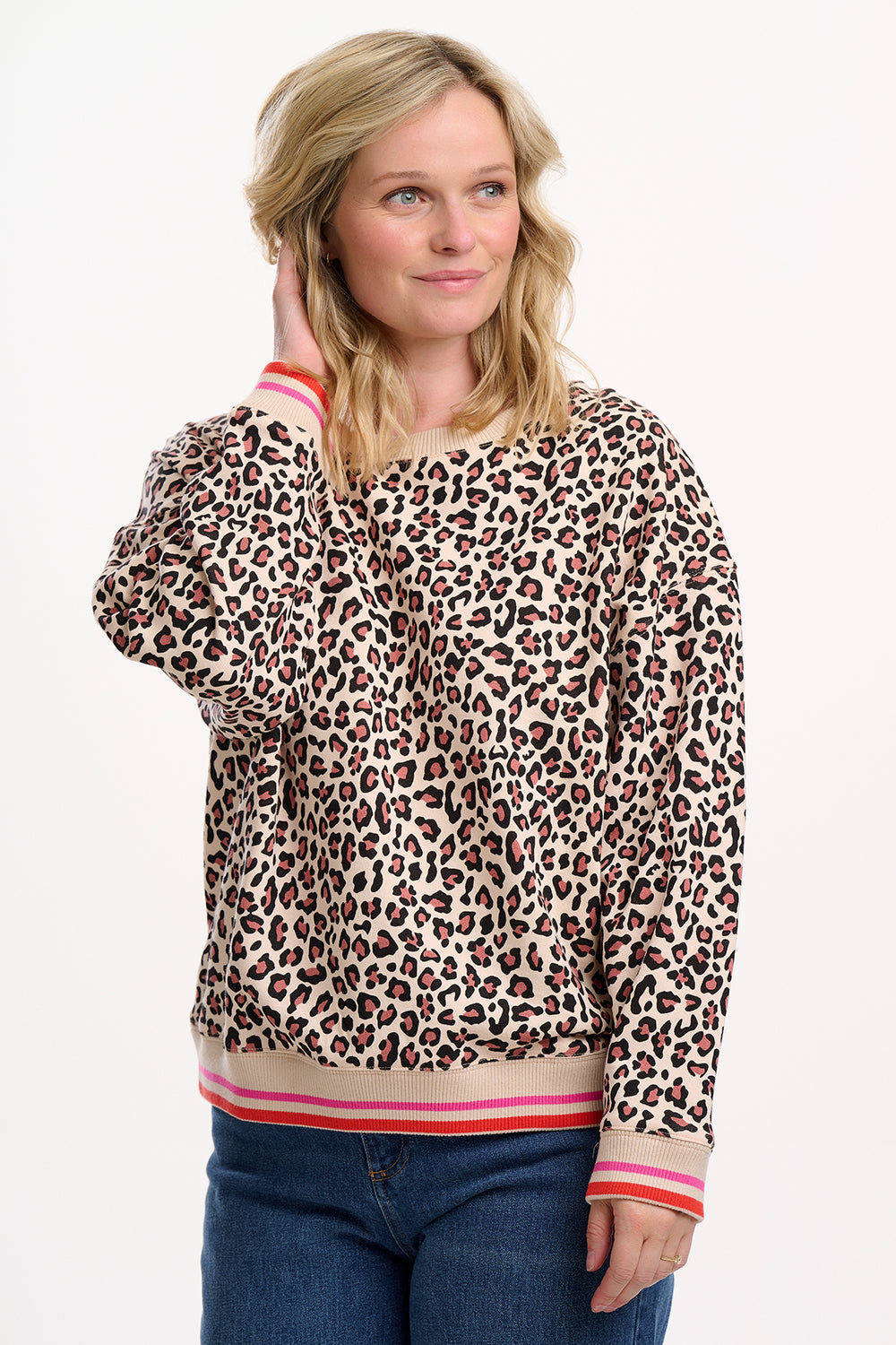 Relaxed, bold, and irresistibly soft from SUGARHILL— the Eadie Oversized Sweatshirt is made from 100% Organic Cotton Jersey for ultimate comfort. This hypoallergenic crew neck sweatshirt features a natural-toned leopard print, contrasted by striped ribbed trims at the cuffs and hem in vibrant coral and pink. The drop shoulders and oversized fit create a laid-back silhouette, while the super soft interior makes it perfect for all-day wear. Style it with jeans or joggers for easy everyday cool.
