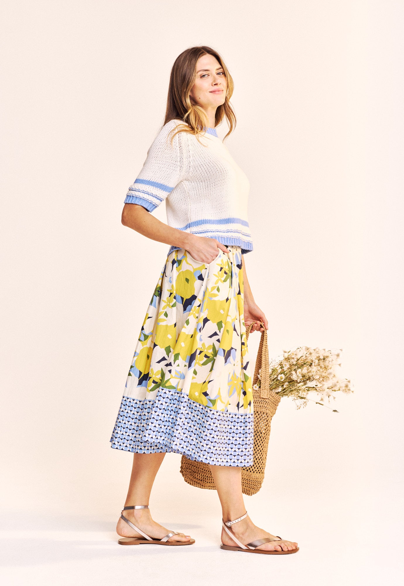 This great little Summer knit from ONE COLLECTIVE is a cool cropped and boxy shape. In a white cotton with accents of pale blue this works great with denim. The fit is true to size.