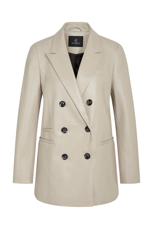 Classic tailored blazer with a lapel collar from Bruuns Bazaar . Featuring front flap pockets and a double-breasted six button fastening at the front. Made from Vegan leather this is super soft and classic. The fit is true to size. Fully lined piece.