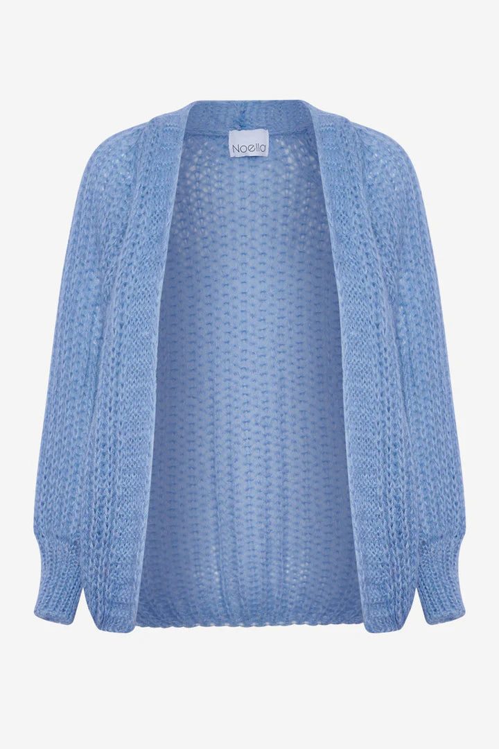 The Joseph Cardigan is one of our popular Noella cardigans, in a beautiful soft colour. It has a loose fit and an open knit. It has dropped shoulders and ribbing at the wrists. Knitted on larger needles it has a light and airy look perfect for Spring. The fit is true to size but loose fitting with a wider sleeve.