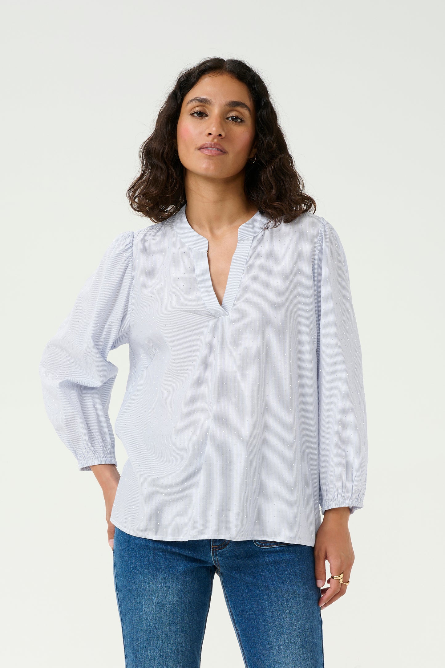 The KAMilena blouse by Scandi brand KAFFE is a beautiful piece. The notch neck style blouse is in a fine blue and white stripe and is embellished with tiny sparkles. Stunning with denim or with white shorts in high summer this will take you anywhere. The long sleeves have an elasticated cuff and the hem is straight. The fit is true to size.