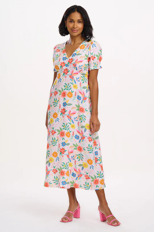 The Maryjane dress showcases a timeless V-neck tea silhouette, complete with an empire bust line and charming short-shirred cuffs. It's adorned with our vibrant new Tropical Hummingbird print, featuring a delightful array of colourful flowers and hummingbirds set against a soft off-white background.
Margarita is 5'9" and is wearing a size 10
100% LENZING™ ECOVERO™ Viscose
Machine Washable (Delicate)
V-neck
Tea dress shape
Short sleeves with shirred cuffs
Empire bust line
Neck to hem length for a size 12: 1