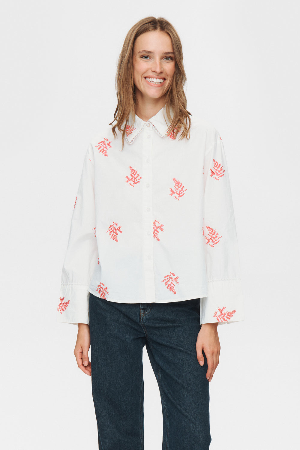 Smart yet relaxed, this shirt from NUMPH blends crisp cotton with fern embroidery. Its regular fit promises comfort on busy days, while the button neck and long sleeves add just enough structure for wherever your plans take you. The fit is true to size.