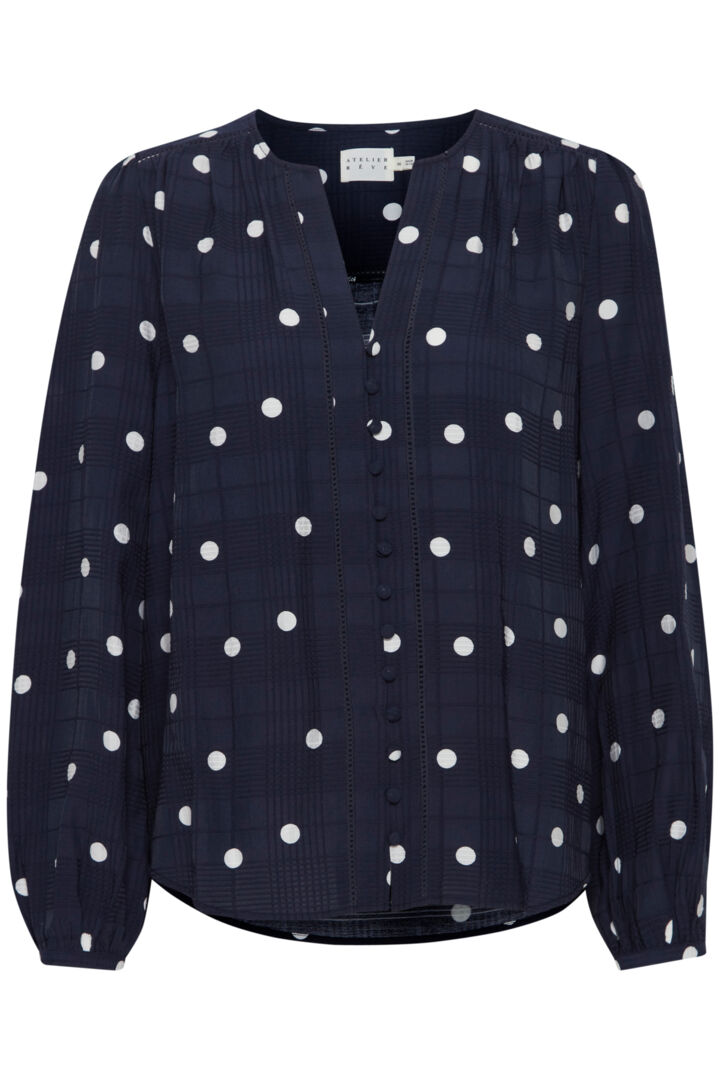 The beautiful Salina blouse by Atelier Reve "fashion house of dreams" is a must have piece for any capsule wardrobe. The stylish navy and white polka dot print works really well for work with a smart blazer or casually with a great pair of jeans. Collarless with a notch neck it flatters a bigger bust and the covered buttons add that little bit of lux to this piece.