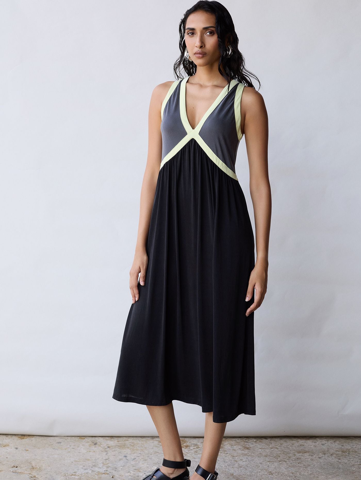 A beautiful summer dress from SKATIE. This sleeveless floaty dress is perfect for day wear or an event. The two tone dress has a vibrant neon yellow cross over at the bust to give shape. The straps are wide enough to cover a bra strap. Floaty and comfortable. Fit is neat.