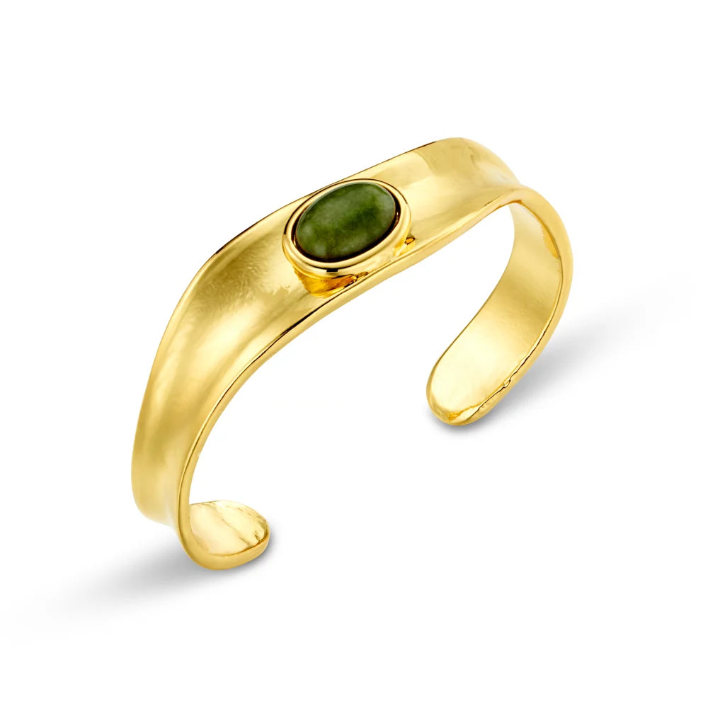 The Organic Semi-Precious Green Jade Cuff from ORELIA features soft curves and subtle depth, framing an earthy jade stone that stands out beautifully against the polished gold.