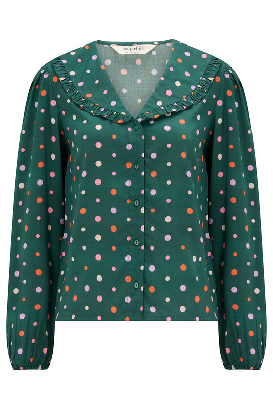 The Jess Blouse from SUGARHILL is a pretty and versatile style featuring a flattering V-neckline with a delicate frill-trimmed collar. The long sleeves are finished with elasticated cuffs for a comfortable fit, while the multi-coloured spot print adds a fun and playful touch. Easy to dress up or down, the Jess is a lovely addition to any wardrobe.