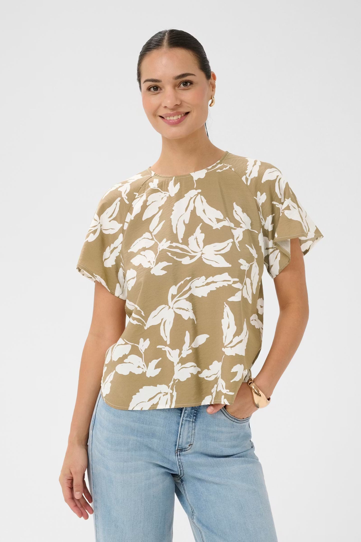 Blouse with an airy fit from Scandi brand KAFFE, round neckline, and short flutter sleeves, featuring an allover leaf print and a subtly textured, smooth finish. Effortlessly cool top for a modern wardrobe update.