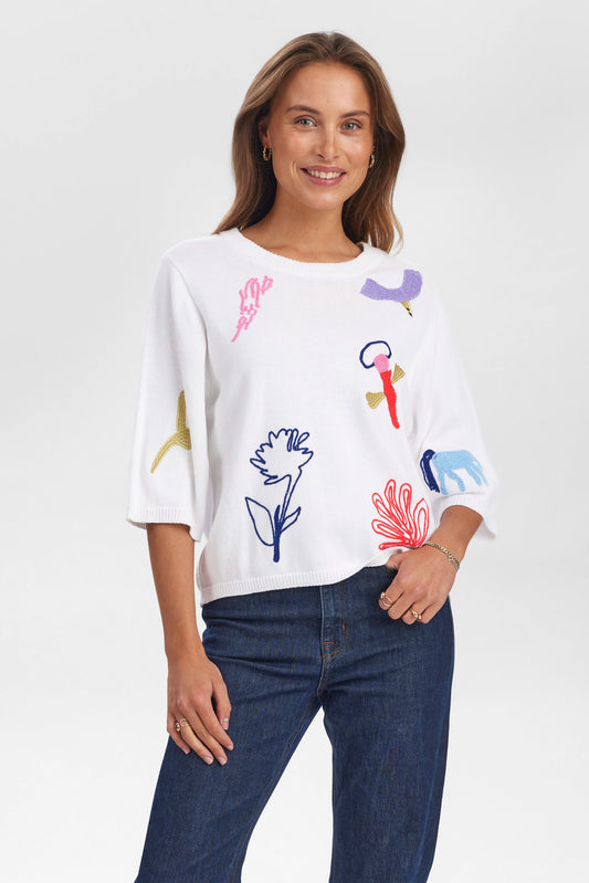 The great NUDebrah knit from Scandi Brand NUMPH is a playful and fun piece for Summer. A short sleeved boxy knit with an elbow length sleeves and straight hem. There is a quirky variety of embroidered designs on the front and the word "Dreamer" on the back.