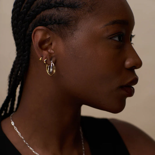 Meet your new mixed metal statement hoops from ORELIA, the Mixed Plate Interlocking Hoop Earrings. Featuring an interlocking design, combining both gold and silver plating, and clip clasp fastening.