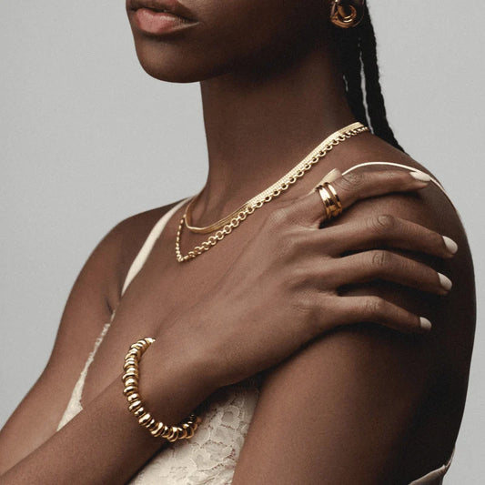 The sleek, contemporary design of this bracelet from ORELIA adds a bold yet effortless touch to any outfit, perfect for stacking or wearing on its own.