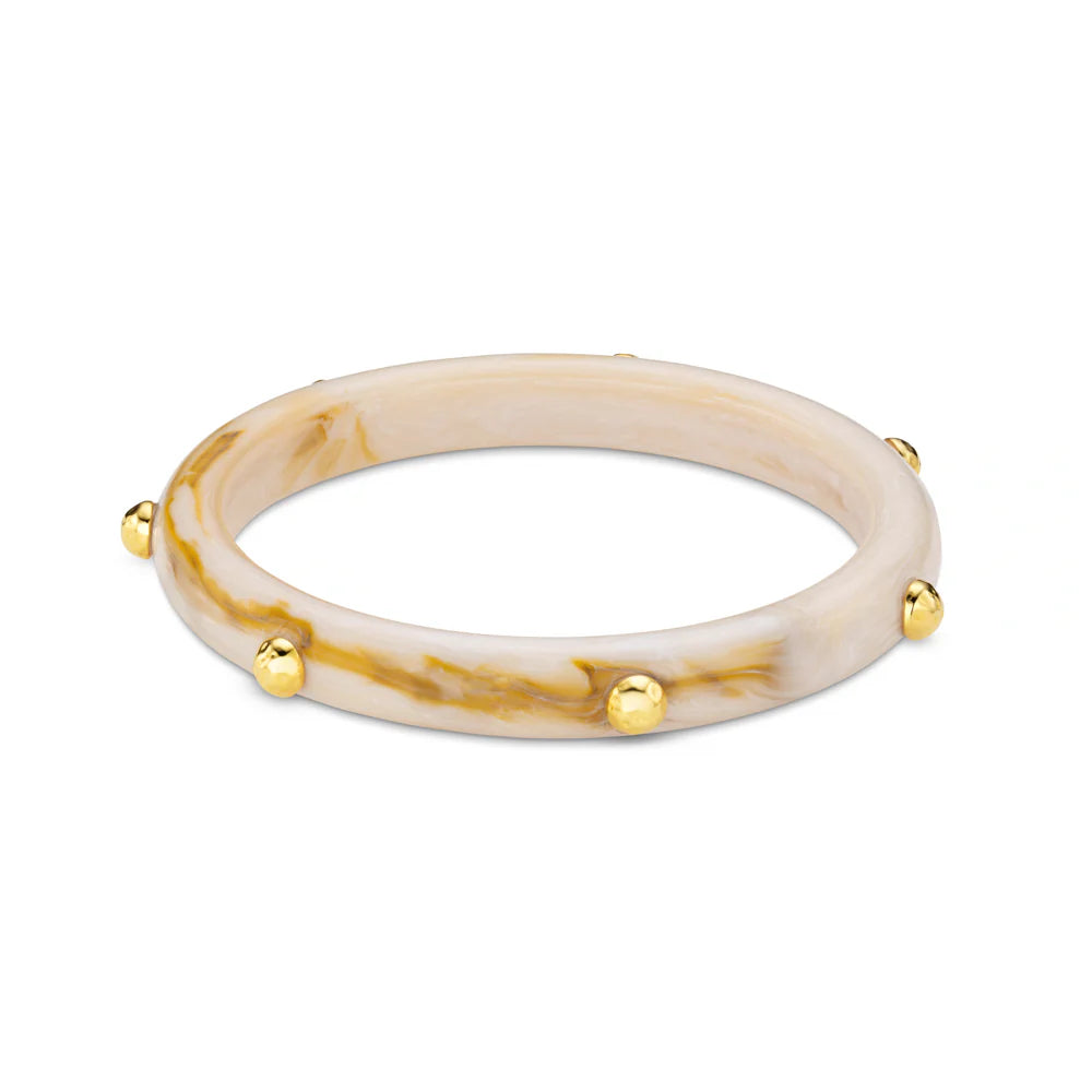 The Marble Resin Studded Bangle from ORELIA combines swirling neutral tones that create a unique, organic feel, while the metallic studs add subtle contrast and structure.