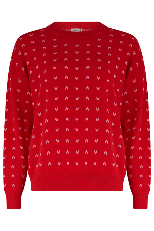 The Andi Jumper from SUGARHILL is a fun and cosy red knit featuring a classic round neckline and long sleeves. Covered in cute mini hearts throughout, this playful design adds a lovely touch of colour and personality to your wardrobe. Made from 61% viscose and 39% cotton, it has no wool content, making it a great choice for our non-wool wearers.