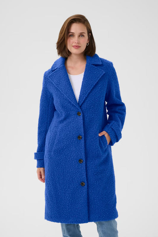 This Scandi brand KAFFE textured coat features a tailored straight silhouette, classic lapel collar, and button fastening. Long sleeves and mid-length create a confident style. A great colour for Winter to brighten any day. The fit is true to size.