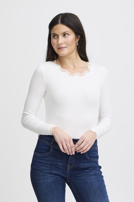 A simple layering piece from Scandi brand FRANSA in a ribbed fabric. Lace trim on the rounded neckline and cuffs add that extra detail.