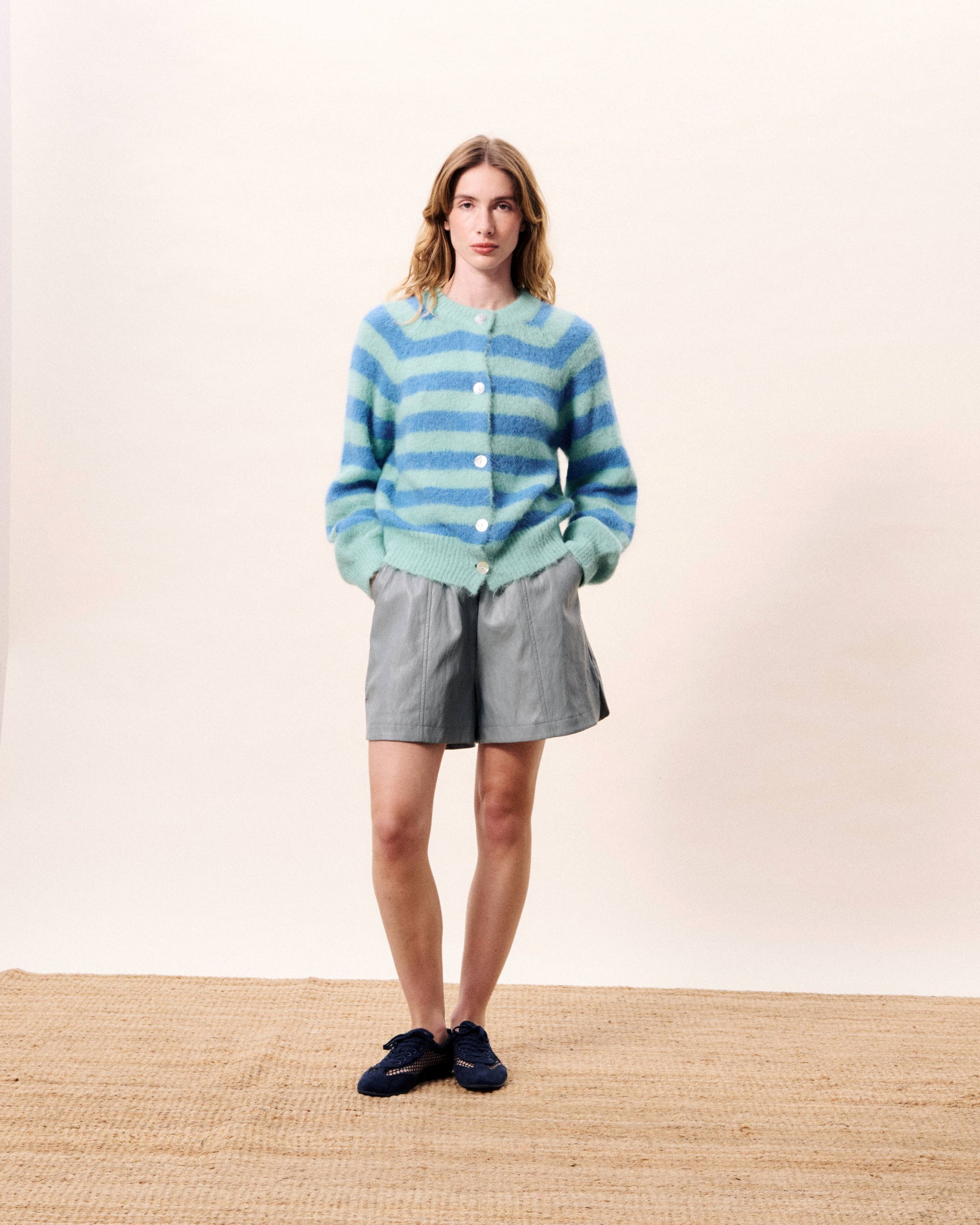 A super cute round neck cardigan in a fluffy knit. from FRNCH. The pastel combination of shades is pretty and stylish. With long sleeves and button fastening this piece is a complete winner. Fits true to size.