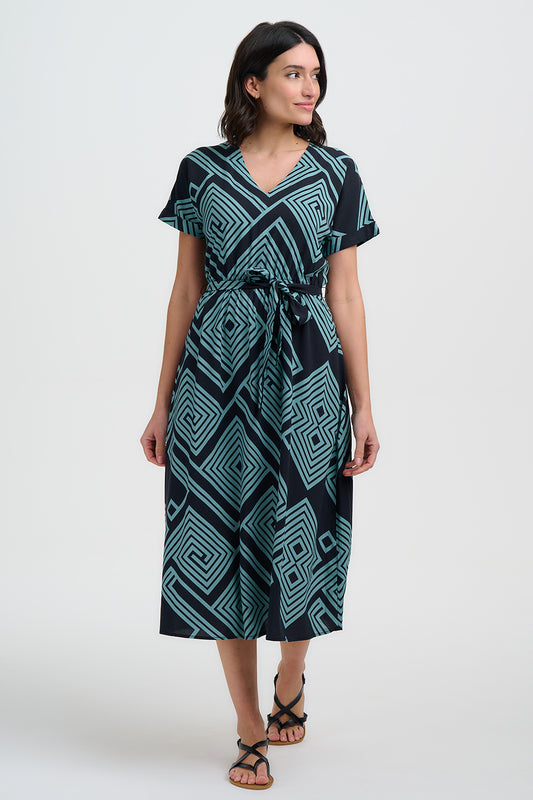 Meet Bethan from SUGARHILL — your new favourite summer statement dress. Designed with a short sleeves, a flattering V neck, and a flowing midi length skirt, this style combines comfort and charm in equal measure. Like all the best dresses, it has pockets! The teal geometric spirals and diamonds print create a bold, maze-like pattern on a black background, making it the perfect trans-seasonal piece for brightening any day.