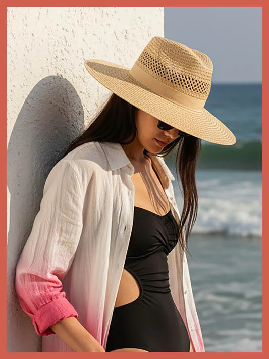 The Beth Oversized Fedora Hat in Ivory from NOOKI, inspired by our favourite cowgirl and her enviable style. Featuring a large brim but on a classic fedora block, this is a showstopper of a hat. Hand woven paper adds a casual edge with cutwork detailing and makes this the summer hat you will look forward to wearing every season