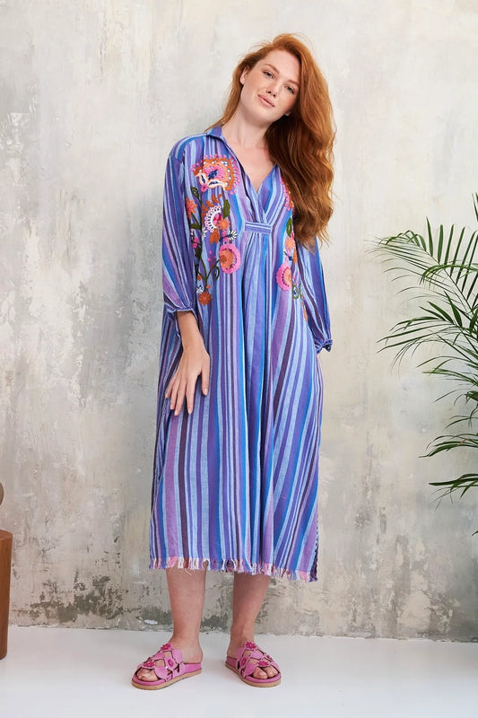 Discover the Bonita dress from French brand Chico Soleil. A Midi length dress in a bohemian style and print with three quarter sleeves made from a sublime cotton fabric. The neckline is embroidered with a unique floral design which makes the dress elegant enough for any occasion. With a V neck and collar to flatter and a side split at the hem either side. The finishing touch is pockets on the side seems.
