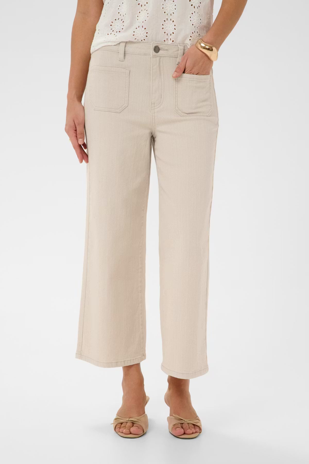 Cropped wide leg jeans feature a flattering high-rise waist, front patch pockets, and subtle A-line silhouette from Scandi brand KAFFE. Belt loops and button fly enhance the structured look. Patch front and back pockets complete the look. The fit is true to size.