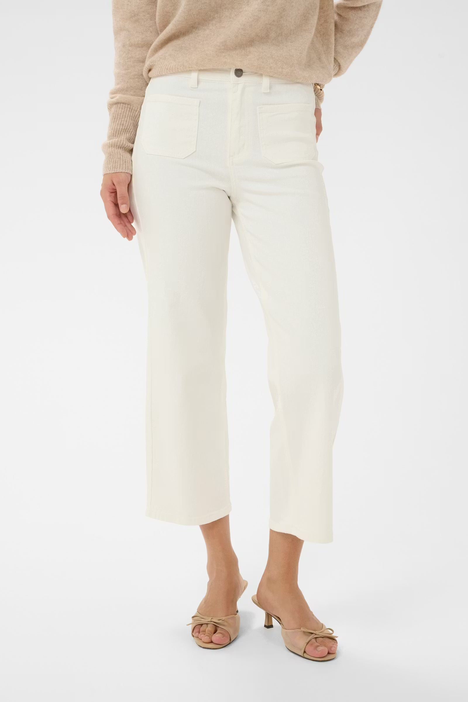 Cropped wide leg jeans from KAFFE feature a flattering high-rise waist, front patch pockets, and subtle A-line silhouette. Belt loops and button fly enhance the structured look. Fit is true to size.