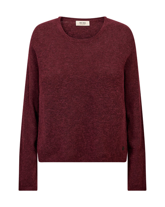 This luxurious knit sweater from MOS MOSH is crafted from a soft wool-mohair-alpaca blend, offering warmth and comfort with a touch of effortless elegance. Designed in a regular silhouette with a classic O-neck, it drapes beautifully for a timeless and versatile look. Perfect for layering, style it with tailored pants or your favourite denim for a chic yet relaxed outfit.