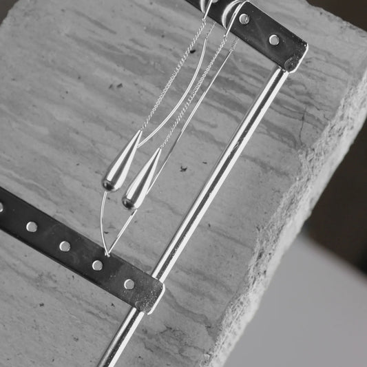 The Passion Waterproof Smooth Drop Chain Earrings with Silver plating embody Danish design elegance. Hypoallergenic and resistant to perfume and water, they maintain their shine without tarnishing, making them perfect for trendy, all-day wear with lasting comfort and style.