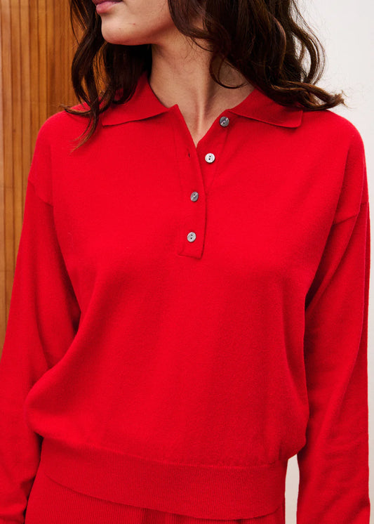 The Chedid jumper by Parisian brand FRNCH is an easy wear piece yet the bright tomato red makes it a stand out piece. A simple clean cut and classic knit with a collar and button placket makes this really easy to wear. Pair with denim and a blazer for a classic look or with a wide leg jean for a fashion statement. The long sleeves have a fin ribbed cuff. The fit is very small so please size up.