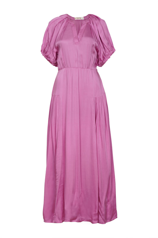 A stunning piece from BRDR which is perfect for any occasion. In a silky feel fabric and a vibrant lilac this piece will take you anywhere. A maxi length Summer dress with gently puffed sleeves and a flattering notch neck with gentle gathering around the neck. The skirt has pleating either side to add fullness. There are also pockets in the side seems and a self coloured belt. Fully lined with a cotton lining.