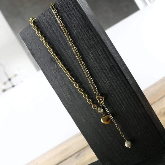 Let your special someone know just how much you care with this elegant Love Waterproof Clear CZ Multi Chain Necklace 18K Gold Plating. Crafted in 18K gold plating and featuring a mix of chains, freshwater pearl, and Cubic Zirconia, this necklace is sure to stand out.