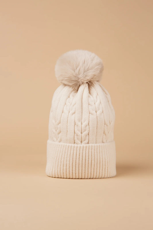 Our ultra-cosy fleece-lined bobble hats feature a chunky knit design and are topped with a fluffy pom-pom. These hats are the perfect winter essential. Warm, soft, and snug, these hats are ideal for cold-weather layering. Available in other colours to suit every wardrobe.