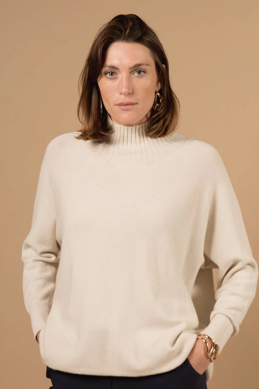 This high neck jumper is a must-have winter staple, crafted in a soft and breathable viscose mix for all-day comfort. The clean silhouette and flattering fit make it an easy addition to any cold-weather collection. Available in different colours, it’s ideal for layering or wearing as a statement piece.