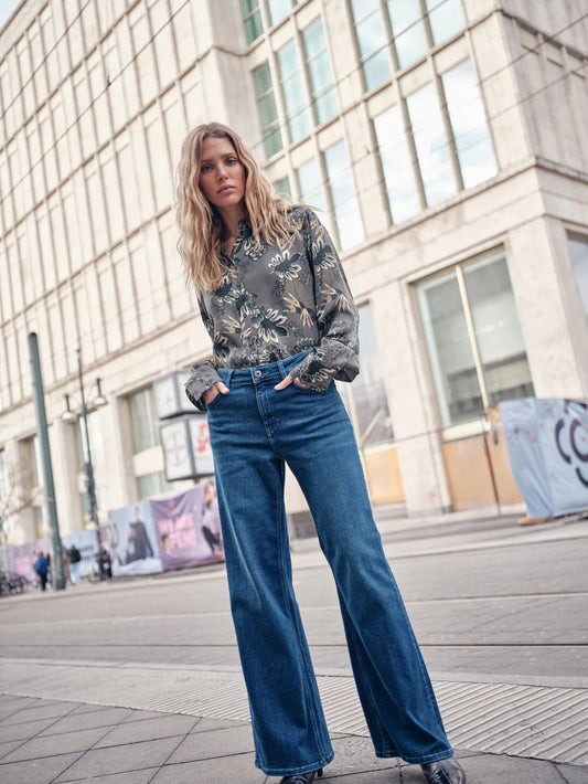 Introducing wide-legged jeans in a stylish blue wash from MOS MOSH with a high-rise fit. Finished with leather detailing at the coin pocket. Pair casually with a chunky knit or dress up with a glitter tank top and oversized blazer for a night out.