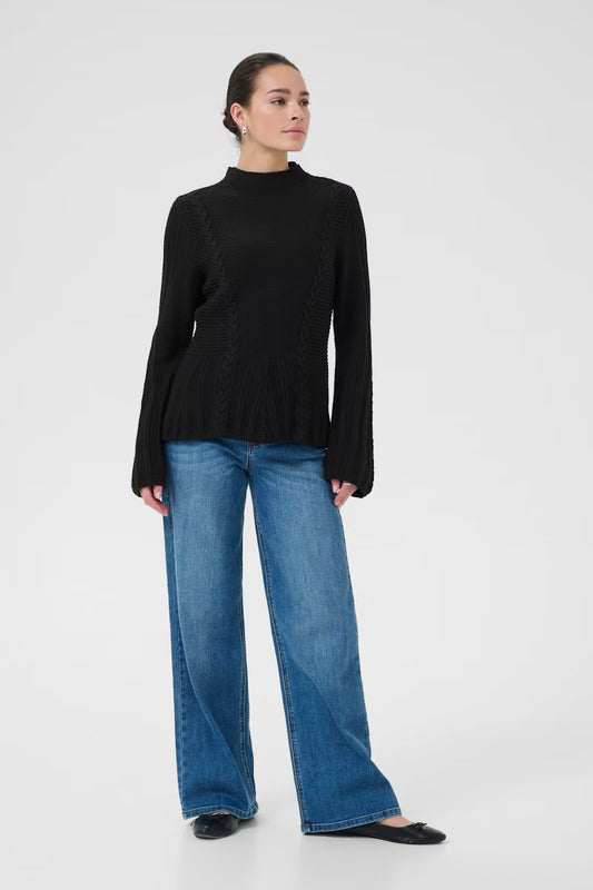 This women's knitted sweater from KAFFE offers a relaxed silhouette with a high neckline and wide long sleeves. Intricate cable knit details and textured stitches create a timeless look suitable for both casual and smart occasions. The fit is true to size and fitted.