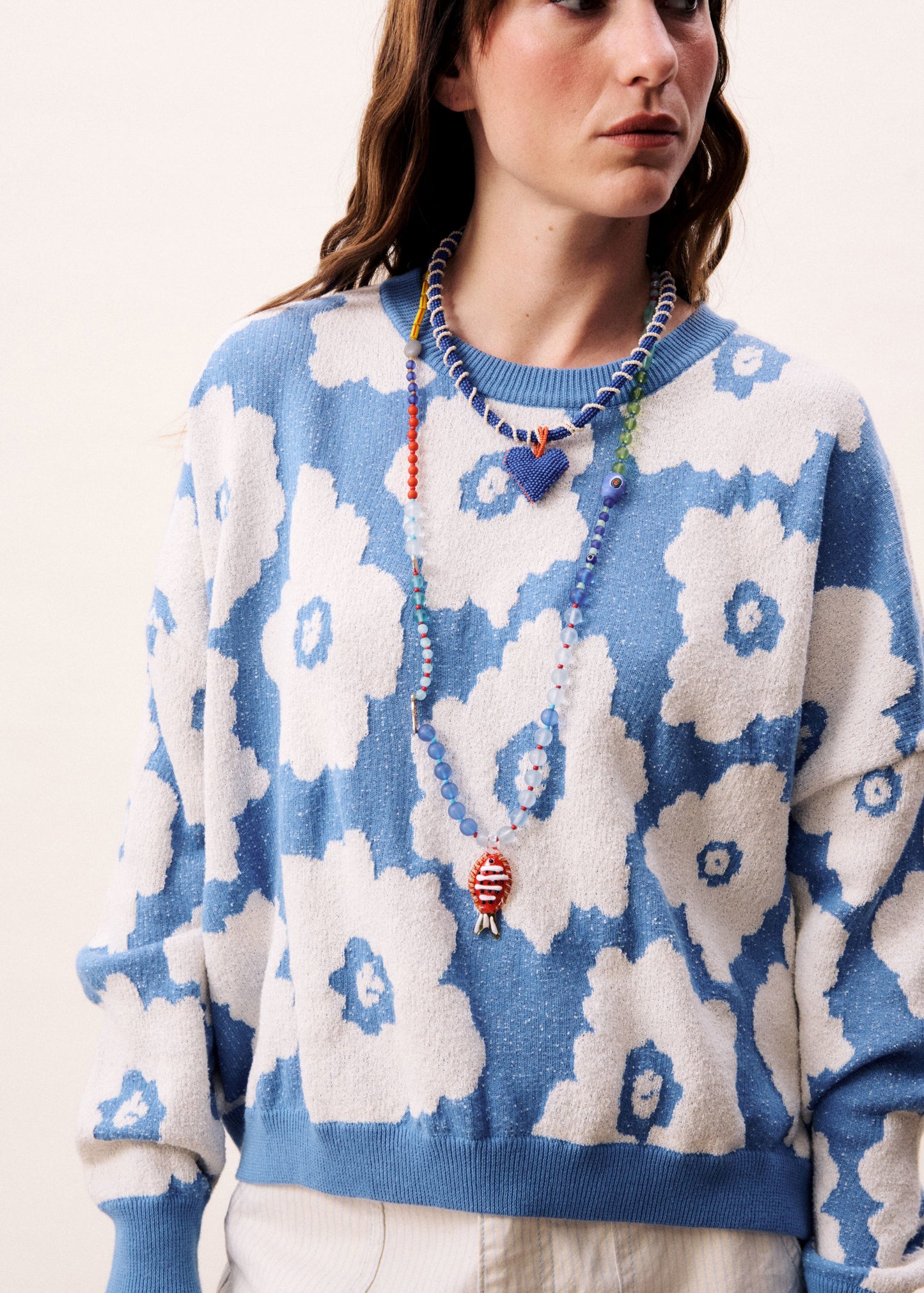 A relaxed, contemporary silhouette with an expressive edge from Parisian brand FRNCH. Crafted from soft knit fabric and featuring bold floral print. This striking blue and white combination is super fresh. The round neck and dropped shoulders are designed to flatter