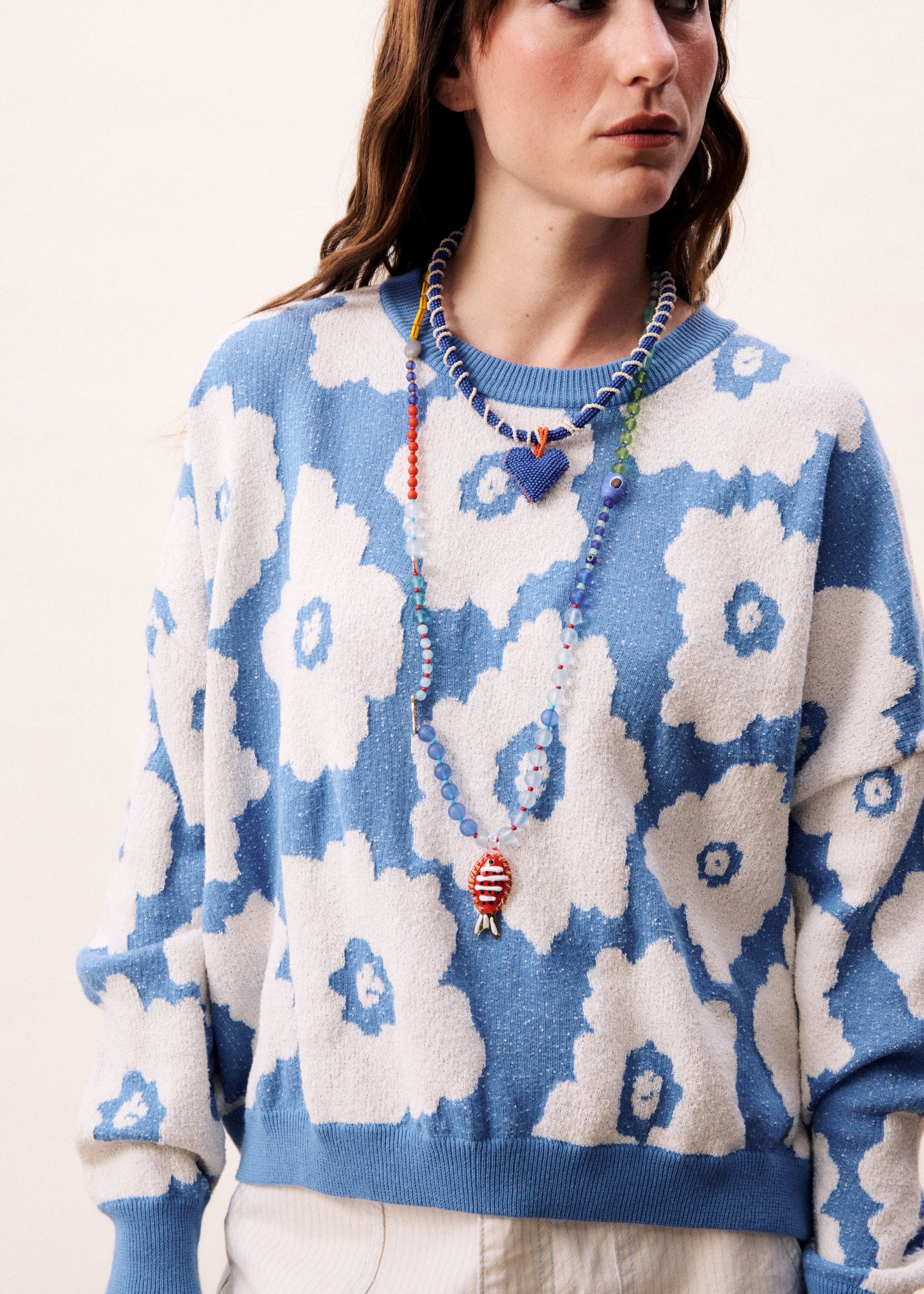 A relaxed, contemporary silhouette with an expressive edge from Parisian brand FRNCH. Crafted from soft knit fabric and featuring bold floral print. This striking blue and white combination is super fresh. The round neck and dropped shoulders are designed to flatter
