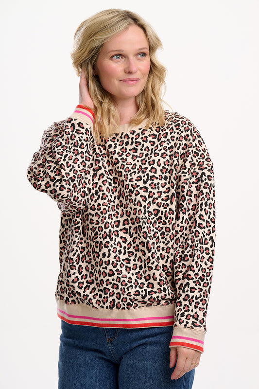 Relaxed, bold, and irresistibly soft from SUGARHILL— the Eadie Oversized Sweatshirt is made from 100% Organic Cotton Jersey for ultimate comfort. This hypoallergenic crew neck sweatshirt features a natural-toned leopard print, contrasted by striped ribbed trims at the cuffs and hem in vibrant coral and pink. The drop shoulders and oversized fit create a laid-back silhouette, while the super soft interior makes it perfect for all-day wear. Style it with jeans or joggers for easy everyday cool.