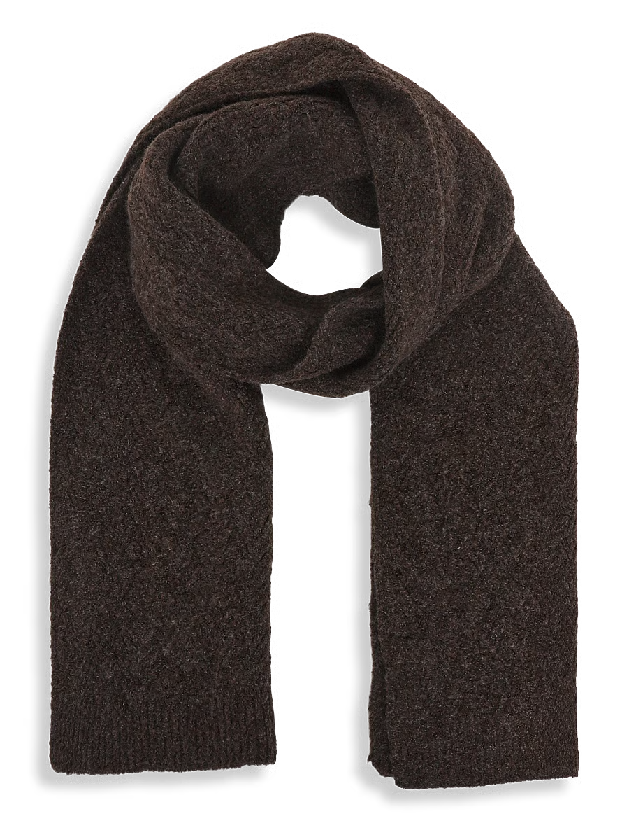 This cozy scarf from FRANSA offers a soft, textured feel, perfect for adding warmth and style to your winter wardrobe. Its generous length allows for versatile styling, whether wrapped snugly around the neck or draped loosely over the shoulders. The subtle knit pattern adds a touch of visual interest to this essential accessory.