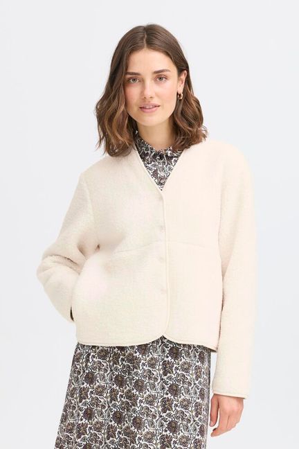 A great faux fur/fleece jacket in a vibrant cream textured fabric from FRANSA. With a V neck and poppers to close this simple piece will keep you super cosy. The long sleeves have a contrast trim and there are side pockets.