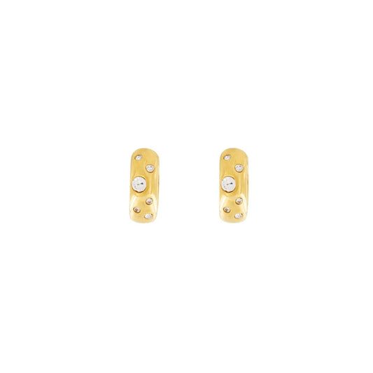 This Joy Waterproof Clear CZ Huggie Earring features a chunky and smooth design plated in 18K Gold, making it both stylish and luxurious. Enjoy the secure fit and waterproof protection of its huggie design, perfect for everyday wear.