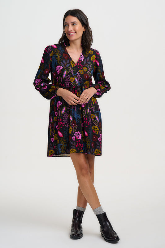 This mini dress from SUGARHILL brings the drama in a fun, flirty silhouette. Bold and dramatic, this striking print features a prowling panther silhouette set amongst a lush, maximalist jungle of oversized blooms and exotic foliage.