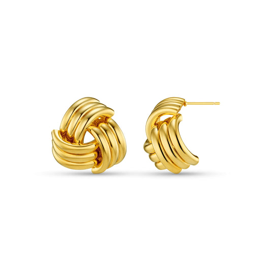 Sculptural and striking, the Interlocking Statement Stud Earrings feature bold, linear curves, intertwined in a sleek, silhouette. With their refined shape and high-shine finish, these studs offer the drama of a statement earring with the ease of an everyday piece.