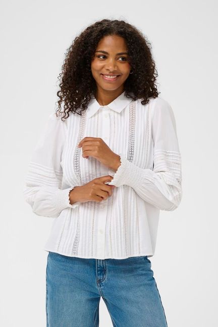 Elevate your everyday wardrobe with the Kaffe KAbella Shirt in crisp optical white. This timeless collared piece features refined ribbed detailing at the cuffs and a classic button closure for effortless sophistication. Perfect for layering or wearing solo, its clean lines and premium finish make it an essential investment that transitions seamlessly from office to weekend. A versatile staple that works harder than it looks.