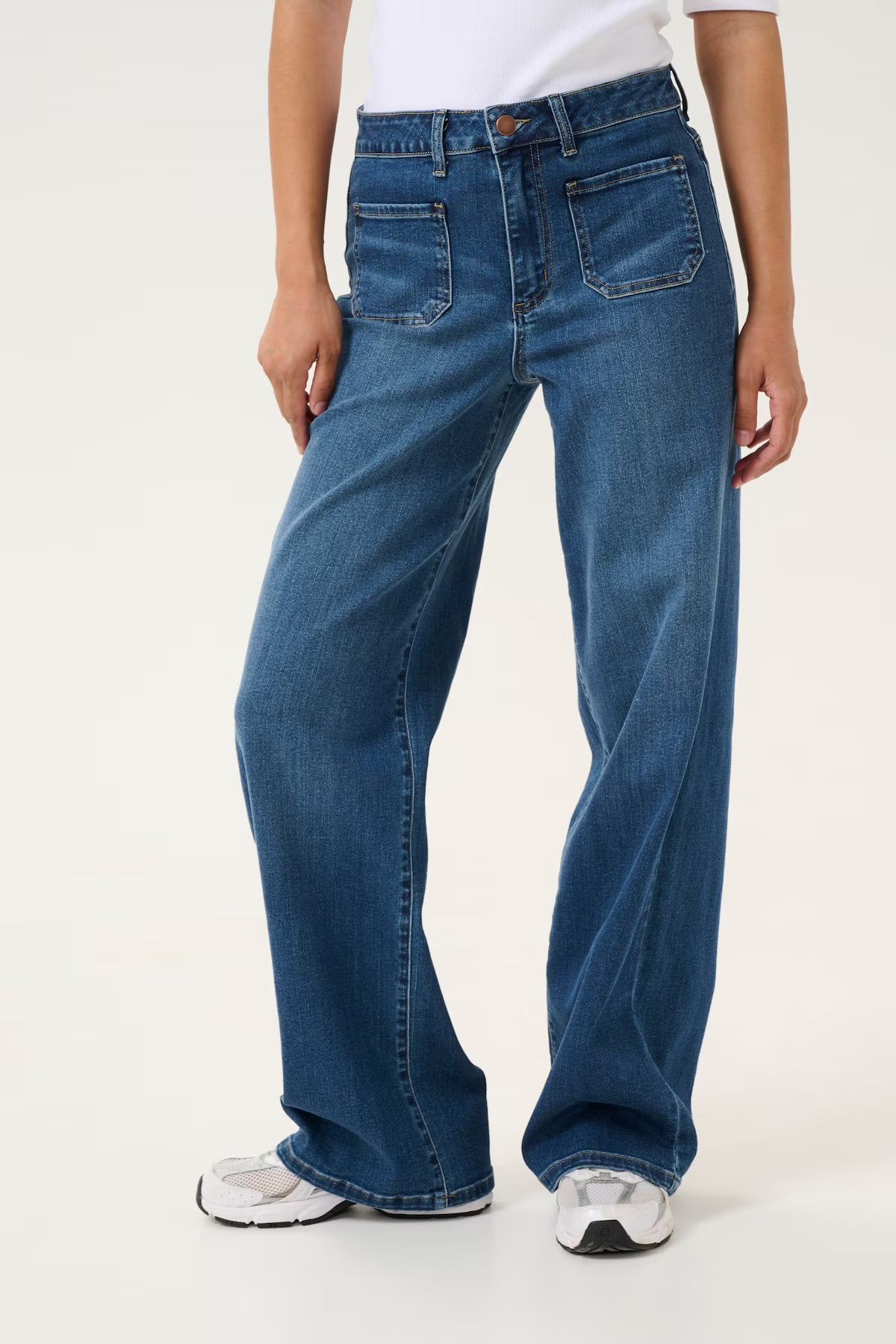 Update your jeans collection with the Karla High Waist Jeans from Scandi brand KAFFE. Designed in a comfortable wide leg, with a high waist and button closure. Featuring pockets to the front and back, in a classic medium blue effect. They are a wardrobe staple this season.