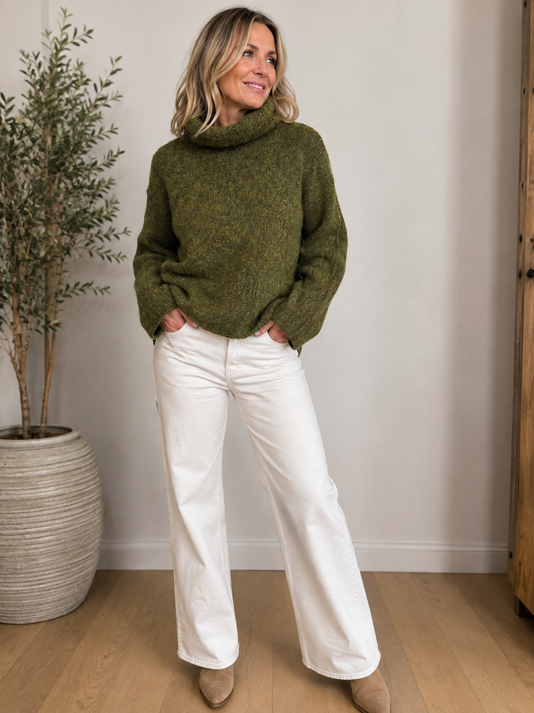 The perfect chunky knit for the colder weather from our new brand 24 COLOURS . This boxy jumper is in a mixed green fleck, it has a loose polo neck and long sleeves with a wide cuff. Perfect worn with denim and super soft and comfortable.