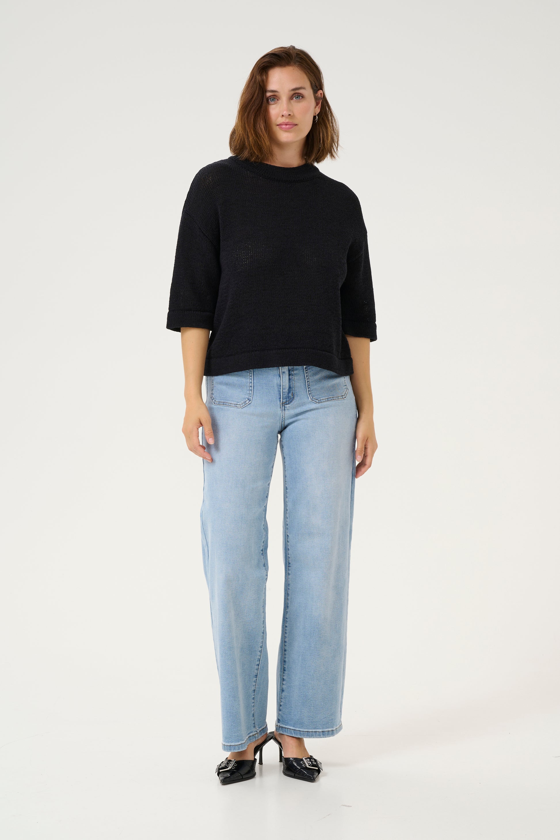 A great summer knit from Scadi brand KAFFE at a fabulous price point. Boxy with an elbow length sleeve and a slightly higher round neck this is a great piece for the better weather or for layering now. The fit is true to size.